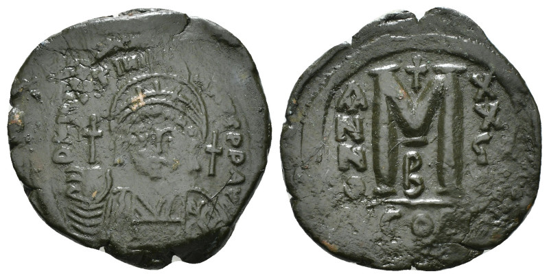 JUSTINIAN I (527-565). Follis.
Obv: D N IVSTINIANVS P P AVG.
Helmeted and cuiras...