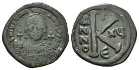 JUSTINIAN I (527-565). Follis.
Obv: D N IVSTINIANVS P P AVG.
Helmeted and cuirassed bust facing, holding globus cruciger and shield decorated with hor...