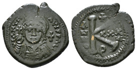 JUSTINIAN I (527-565). Follis.
Obv: D N IVSTINIANVS P P AVG.
Helmeted and cuirassed bust facing, holding globus cruciger and shield decorated with hor...