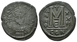 JUSTINIAN I (527-565). Follis.
Obv: D N IVSTINIANVS P P AVG.
Helmeted and cuirassed bust facing, holding globus cruciger and shield decorated with hor...