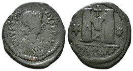 JUSTINIAN I (527-565). Follis. 
Obv: D N IVSTINIANVS P P AVG.
Diademed, draped and cuirassed bust right.
Rev: Large M; cross above; star to left, cros...