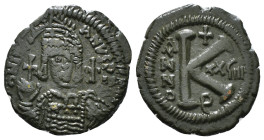 JUSTINIAN I (527-565). Follis.
Obv: D N IVSTINIANVS P P AVG.
Helmeted and cuirassed bust facing, holding globus cruciger and shield decorated with hor...