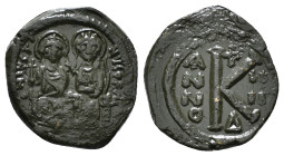 JUSTIN II, with SOPHIA (565-578). Follis. 
Obv: D N IVSTINVS PP AVG.
Justin and Sophia seated facing on double throne, holding globus cruciger and cru...