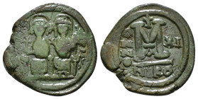 JUSTIN II, with SOPHIA (565-578). Follis. 
Obv: D N IVSTINVS PP AVG.
Justin and Sophia seated facing on double throne, holding globus cruciger and cru...