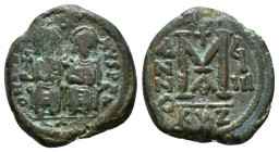 JUSTIN II, with SOPHIA (565-578). Follis. 
Obv: D N IVSTINVS PP AVG.
Justin and Sophia seated facing on double throne, holding globus cruciger and cru...