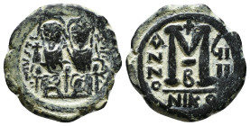 JUSTIN II, with SOPHIA (565-578). Follis. 
Obv: D N IVSTINVS PP AVG.
Justin and Sophia seated facing on double throne, holding globus cruciger and cru...