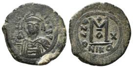 MAURICE TIBERIUS.(582-602). Nicomedia.Follis.
Obv : D N MAVR BIRЄ P P.
Helmeted and cuirassed bust facing, holding globus cruciger and shield decorate...