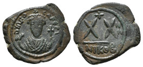 PHOCAS (602-610). Half Follis. Nicomedia. Uncertain RY date.
Obv: Crowned facing bust, wearing consular robes and holding mappa and cross.
Rev: Large ...