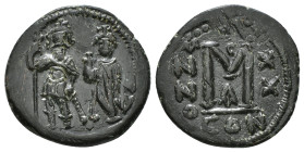 Heraclius and Heraclius Constantine (610-641 AD) Constantinople. AE.
Obv. Heraclius holding long cross and his son a globus cruciger; cross between
Re...