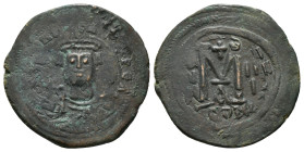 HERACLIUS (610-641). Follis. Constantinople.
Obv: D N hERACLI PERP AVG.
Helmeted, draped and cuirassed bust facing, holding globus cruciger and shie...