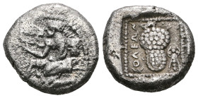 CILICIA. Soloi. Circa 440-410 B.C. AR stater. Amazon kneeling left, wearing pointed bonnet, with drapery around her waist and one breast bare, holding...