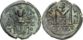 Arab-Byzantine coins, Palestine and al-Urdunn copper coins. 

AE Fals/Follis, Dimashq/Damascus. Enthroned emperor holding a globe with a cross in his ...