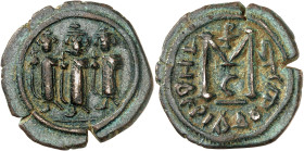 Arab-Byzantine coins, Palestine and al-Urdunn copper coins. 

AE Fals/Follis, Tiberias/Tabarîya. Three emperors standing / M, officina mark C below an...