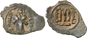 Arab-Byzantine coins, Temp. of ‘Abd al-Malik ibn Marwân, 65-70 H./685-705 AD.

AE Fals of standing caliph type, Filastîn. The caliph with whip hanging...