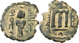 Arab-Byzantine coins, Temp. of ‘Abd al-Malik ibn Marwân, 65-70 H./685-705 AD.

AE Fals of standing caliph type, Luddâ. The caliph holding a sword in s...