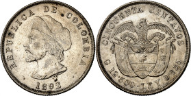 Republic of Colombia.

50 Centavos 1892. Columbus head left (tip of cap to right side of A), date below / Condor with spread wings above flagged arm...