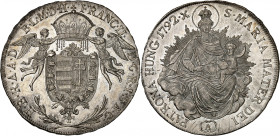 Franz II, 1792-1835.

1/2 Taler 1792 A, Vienna. Angels holding crown above arms / Radiant Madonna and child. 14,01g. KM 408.

NGC MS64 (Top pop). ...