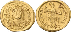 Justin II (565-578). AV Solidus. Constantinople mint, 5th officina. Struck January 566. Obv. Helmeted and cuirassed bust facing, with short beard, hol...