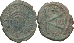 Justin II (565-578). AE Half follis, Thessalonica mint, dated RY 3 (567-568). Obv. Helmeted and cuirassed bust facing, holding globus cruciger and shi...