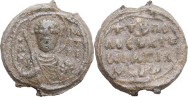 PB Seal, 7-12th century. Obv. Bust of St. Demetrius facing, holding sword and shield. Rev. Inscription in four (4) lines. PB. 6.2 g. 18 mm. Good VF.
