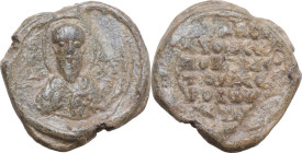 PB Seal, 7-12th century. Obv. Facing bust of a bearded saint. Rev. Inscription in six lines. PB. 5.3 g. 18 mm. VF.