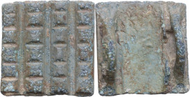 SQUARED BRONZE SEAL Ancient Near East, c. 2nd Millennium BC. Bronze seal of quadrangular shape decorated with linear motifs. On the back are two suspe...