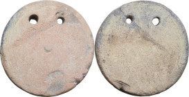 LARGE FRAME WEIGHT Ancient world, c. 5th century BC - 5th century AD. Large round pottery frame weight with two suspension holes. Diameter: 75 mm. Wei...