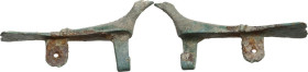 DOVE BRONZE FIBULA Roman period, c. 1st - 3rd century AD. Bronze fibula in the shape of a dove. Lenght: 40 mm. Missing needle.