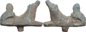 DOG STATUETTE Roman period, c. 1st - 3rd century AD. Bronze statuette in the form of a dog crouched and with head raised. Dimensions: 37 x 29 mm. With...