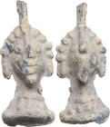 'GROMA' HEAD WEIGHT Roman period, 1st - 4th century AD. Weight in the shape of a janiform head with suspension loop. Dimensions: 36 x 15 mm. Weight: 1...