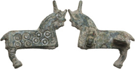 ROMAN BRONZE BROOCH Roman period, Balkans, c. 3rd-4th century AD. Roman bronze fibula in the form of a quadruped (horse?), hooped decoration. Lenght: ...