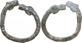BRONZE APPLIQUE Medieval period, c. 7th - 15th century AD (?) Bronze applique in the shape of a double headed serpent or dragon. The bottom is flat. W...