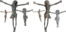 LOT OF THREE CRUCIFIXES Modern period, c. 16th - 18th century AD. Three crucifixes, two made of bronze, one in pewter (?). Heights: 110, 57, 41 mm.