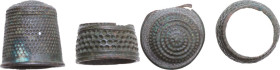 ANCIENT THIMBLES From medieval to modern times. Two bronze sewing thimbles. Height: 19.5 and 11 mm. Minor flaws.