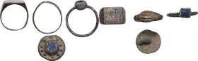 FOUR ITEMS LOT Medieval to modern period, c. 8th to 17th century AD. Lot made of two bronze rings, a silver engagement ring and a lead button (?). Inn...