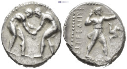 Pamphylia, Aspendos. 370-333 BC. AR Stater (22mm, 10.3 g). Two naked athletes wrestling. Reverse: Slinger advancing right, about to discharge his slin...