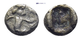 Kings of Persia (Achaemenids). AR 1/32 Siglos (5mm, 0.2 g), c. 450-400 BC. Obv. The Great King, bearded, in "Knielauf" to right, holding bow and dagge...