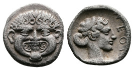 Macedon, Neapolis, circa 424-350 BC. AR Hemidrachm (14 mm, 1,90 g.). Facing gorgoneion with protruding tongue. Rev. ΝE ΟΠ Head of the nymph of Neapoli...