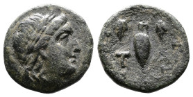 Aeolis, Temnos, circa 2nd.-1st. Century BC. AE ( 16,68mm 3,93 g). Laureate head of Apollo right. Rev. T-A, oinochoe, within vine wreath with two bunch...