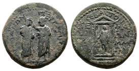 Mysia, Pergamum, time of Augustus, 27 BC- 14 AD. AE. ( 20 mm, 5,63 g.) Proconsul in toga standing facing, being crowned by soldier. Rev. Distyle templ...