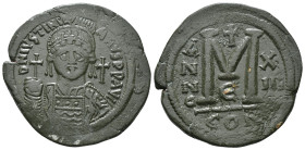 JUSTINIAN I (527-565). Follis.
Obv: D N IVSTINIANVS P P AVG.
Helmeted and cuirassed bust facing, holding globus cruciger and shield decorated with hor...