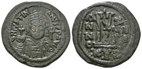 JUSTINIAN I (527-565). Follis.
Obv: D N IVSTINIANVS P P AVG.
Helmeted and cuirassed bust facing, holding globus cruciger and shield decorated with hor...