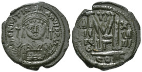 JUSTINIAN I (527-565). Follis.
Obv: D N IVSTINIANVS P P AVG.
Helmeted and cuirassed bust facing, holding globus cruciger and shield decorated with hor...