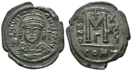 JUSTINIAN I (527-565). Follis.
Obv: D N IVSTINIANVS P P AVG.
Helmeted and cuirassed bust facing, holding globus cruciger and shield decorated with hor...