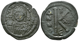 JUSTINIAN I (527-565). Half Follis.
Obv: D N IVSTINIANVS P P AVG.
Helmeted and cuirrased facing bust, holding globus cruciger and shield with horseman...