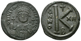 JUSTINIAN I (527-565). Half Follis.
Obv: D N IVSTINIANVS P P AVG.
Helmeted and cuirrased facing bust, holding globus cruciger and shield with horseman...