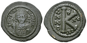 JUSTINIAN I (527-565). Half Follis.
Obv: D N IVSTINIANVS P P AVG.
Helmeted and cuirrased facing bust, holding globus cruciger and shield with horseman...