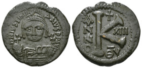 JUSTINIAN I (527-565). Half Follis.
Obv: D N IVSTINIANVS P P AVG.
Helmeted and cuirrased facing bust, holding globus cruciger and shield with horseman...