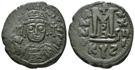JUSTINIAN I (527-565). Follis.
Obv: D N IVSTINIANVS P P AVG.
Helmeted and cuirassed bust facing, holding globus cruciger and shield decorated with hor...