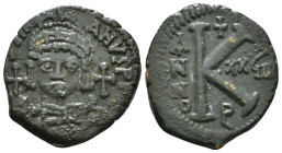 JUSTINIAN I (527-565). Half Follis.
Obv: D N IVSTINIANVS P P AVG.
Helmeted and cuirrased facing bust, holding globus cruciger and shield with horseman...